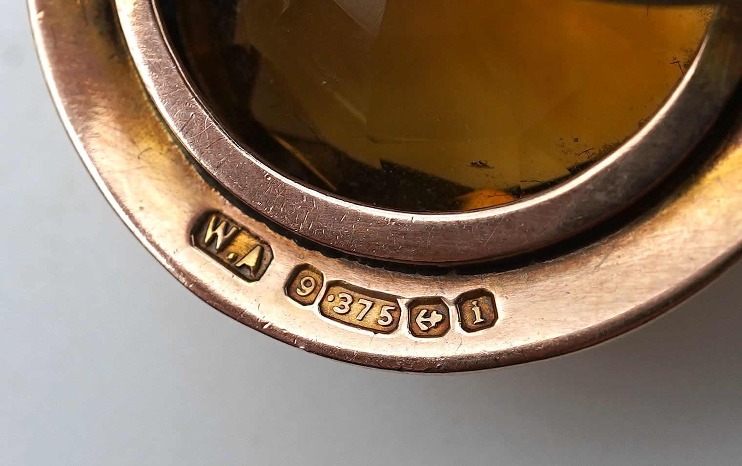 A citrine brooch and pendant, and onyx stickpin